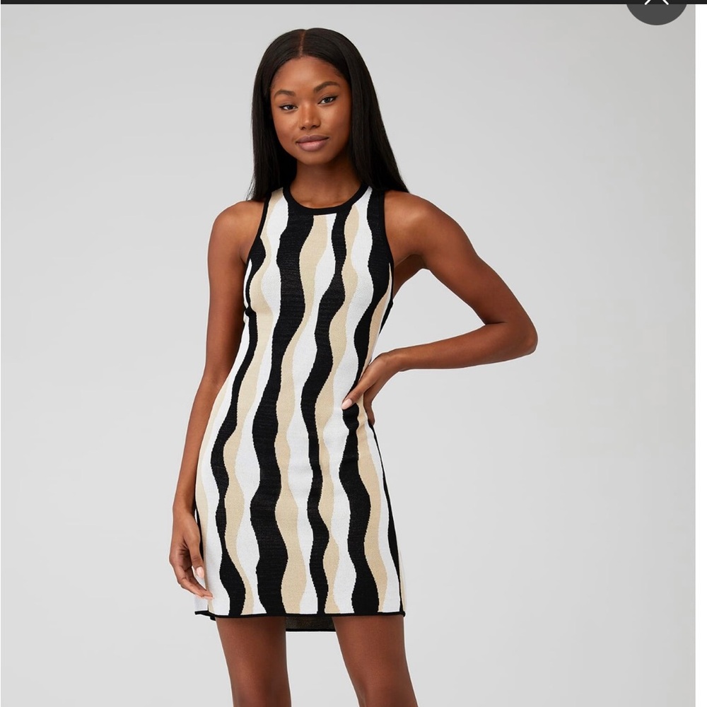 New with tags, never worn. Super cute dress for summer to fall transition